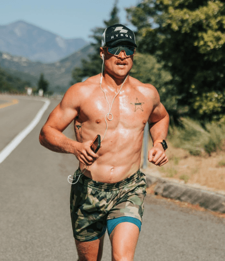 Hunter McIntyre running on a mountain road